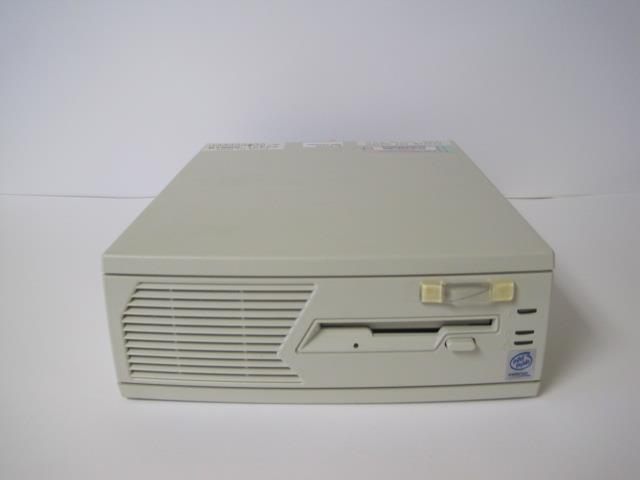 a small computer sitting on top of a white table