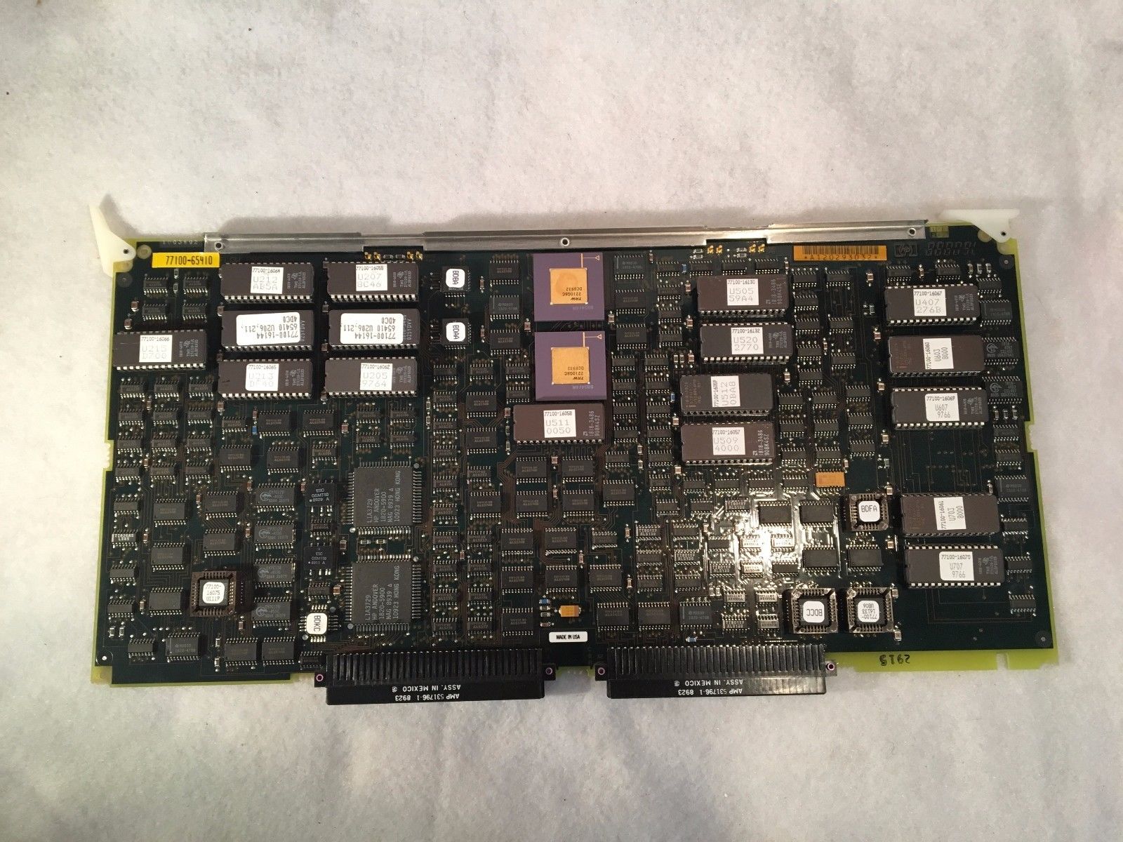 a close up of a computer motherboard on a white surface