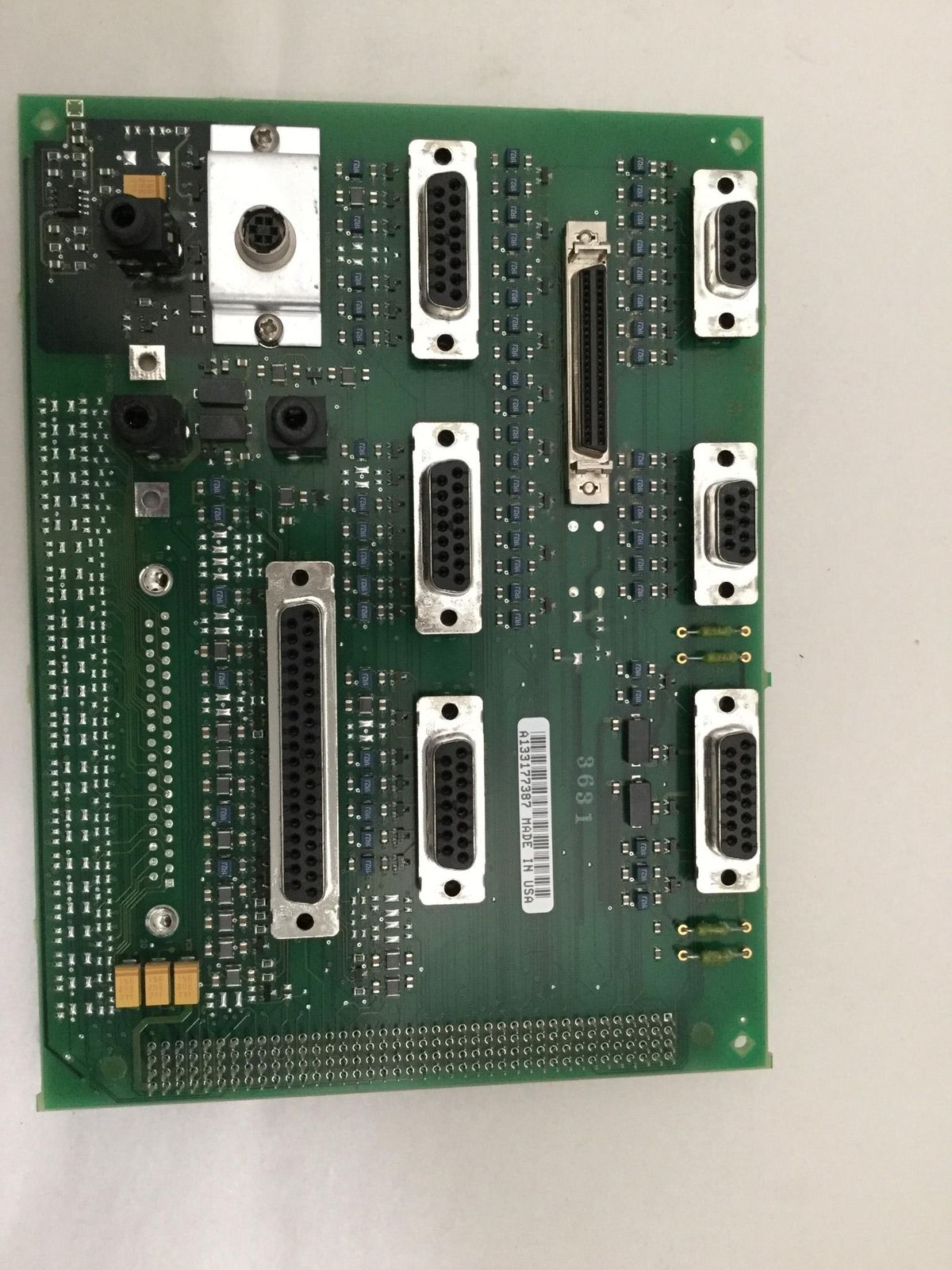 a close up of a computer board with many wires