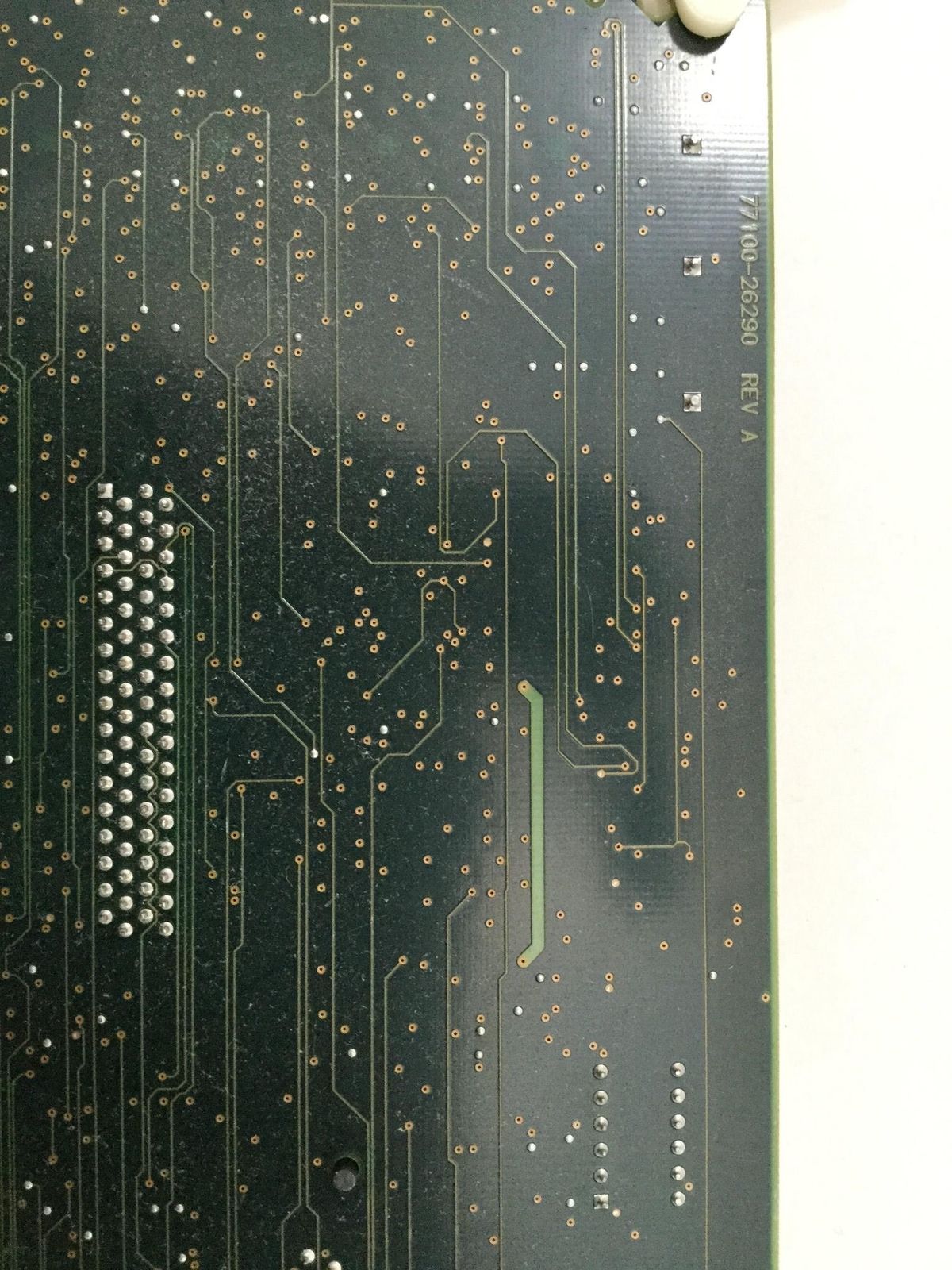 a close up of a circuit board with many holes in it