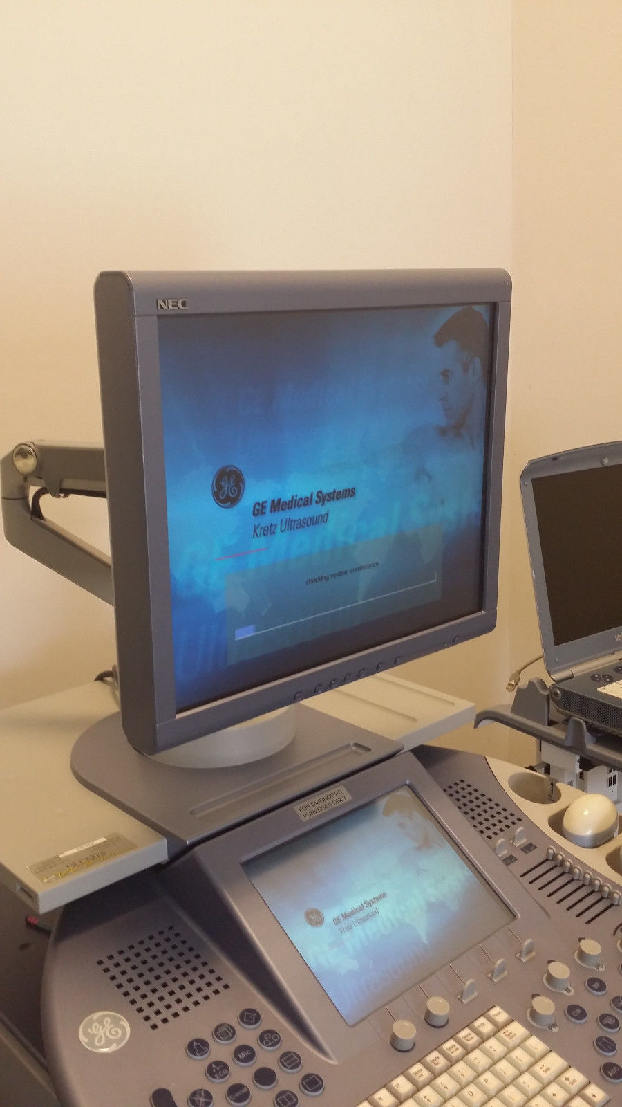 a ultrasound computer monitor sitting on top of a desk