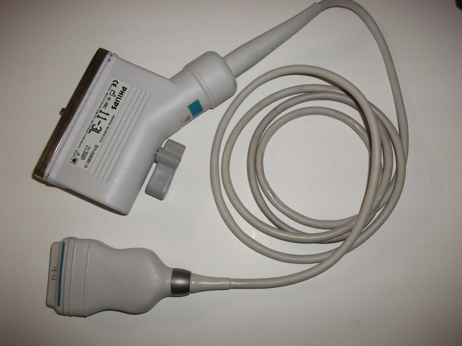 a white cord connected to a device on a table