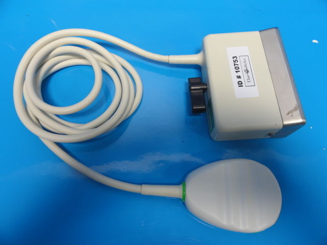 a white probe device on a blue surface