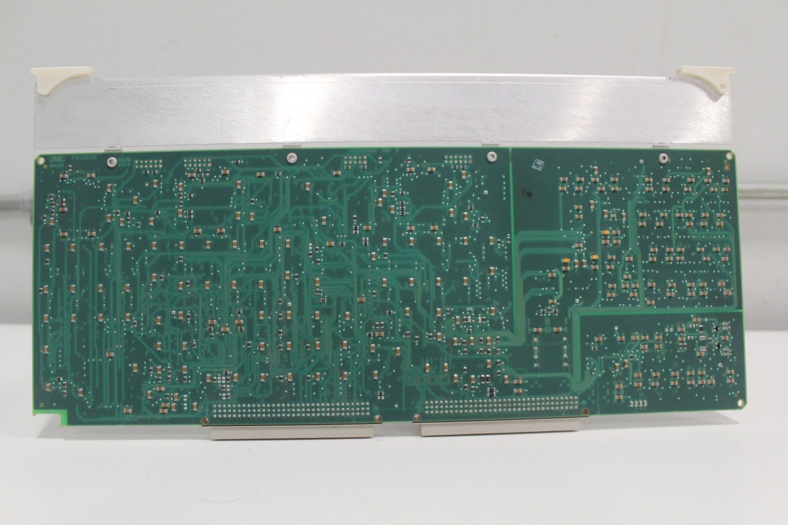 a close up of a circuit board on a white surface