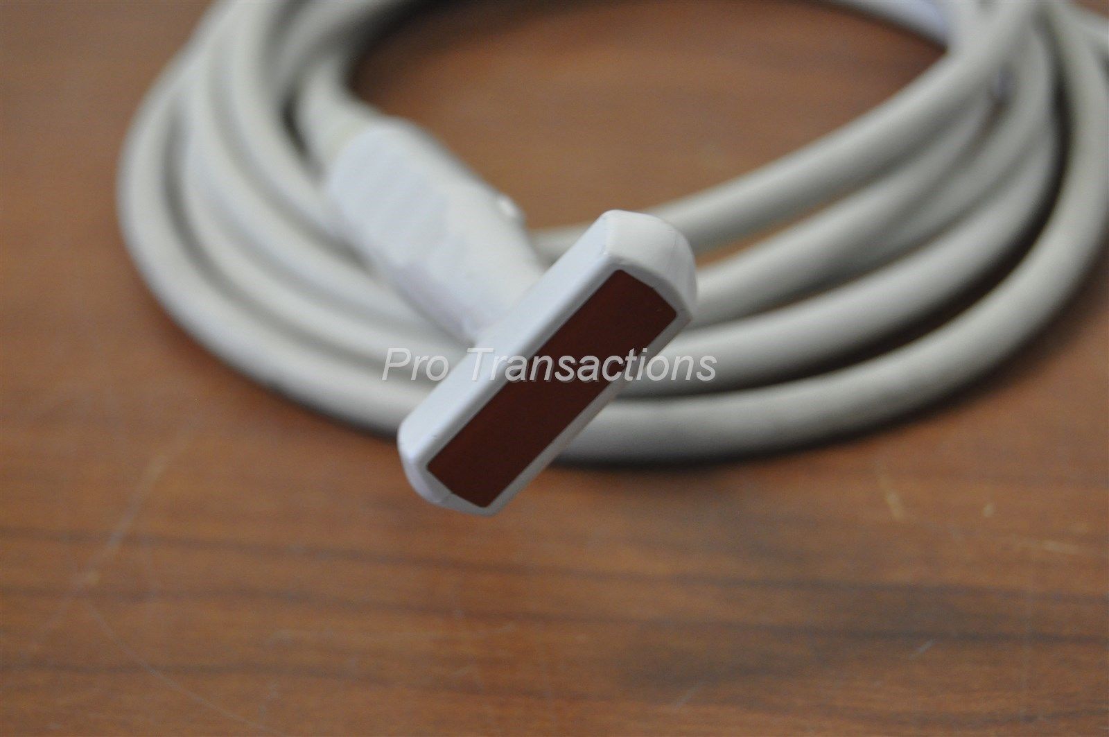 a close up of a white cord on a table