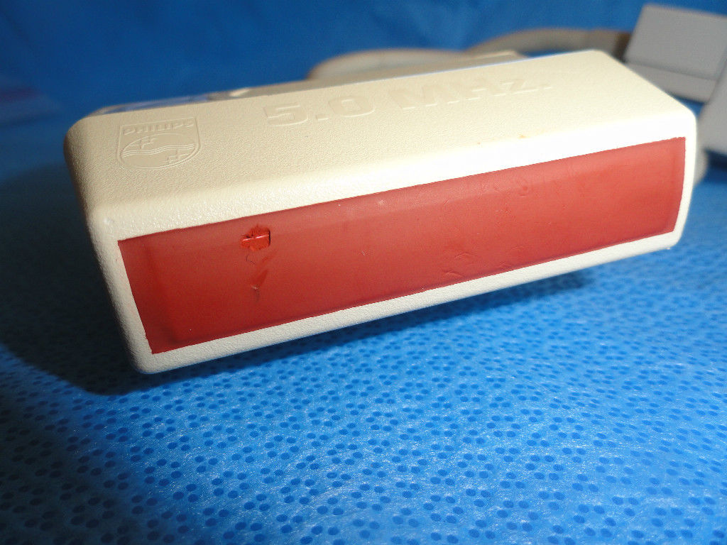 a red and white object sitting on a blue surface
