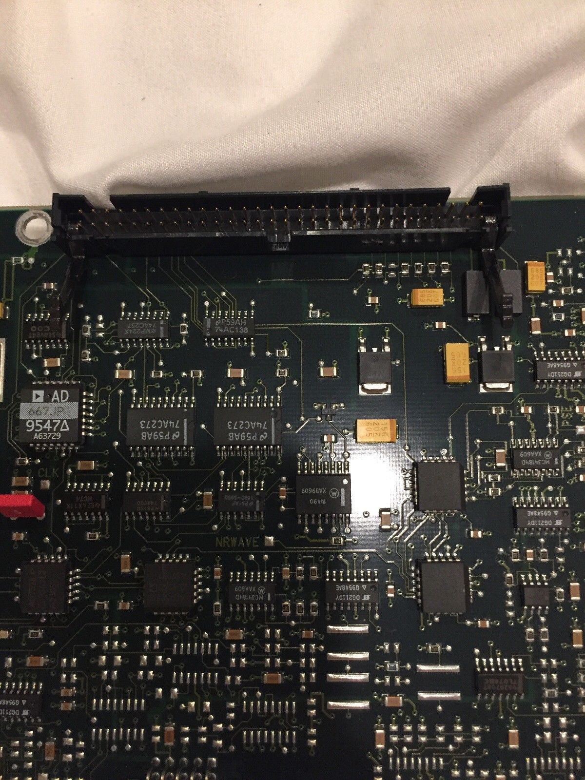 a close up of a computer board with many electronic components