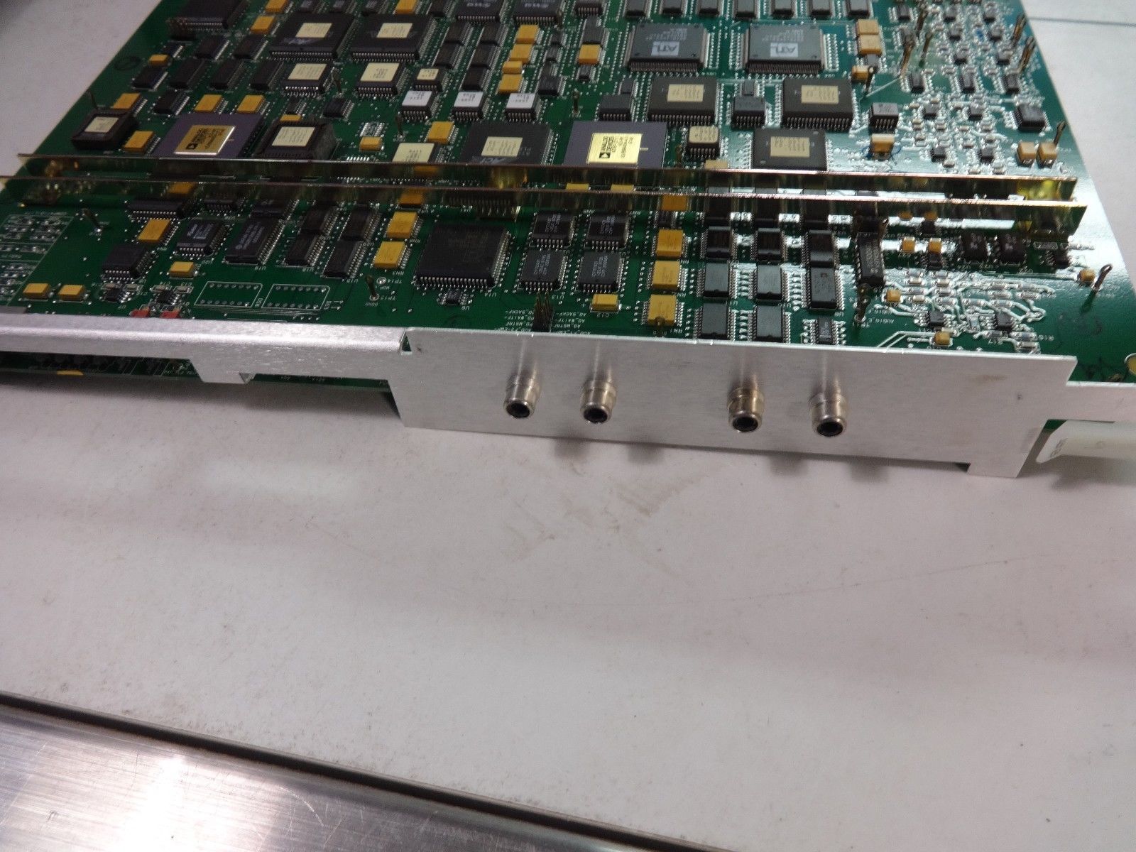a close up of a circuit board with multiple pieces of electronic equipment