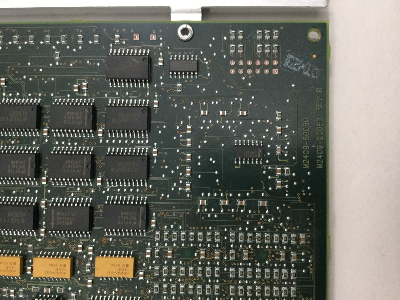 a close up of a computer board with many chips