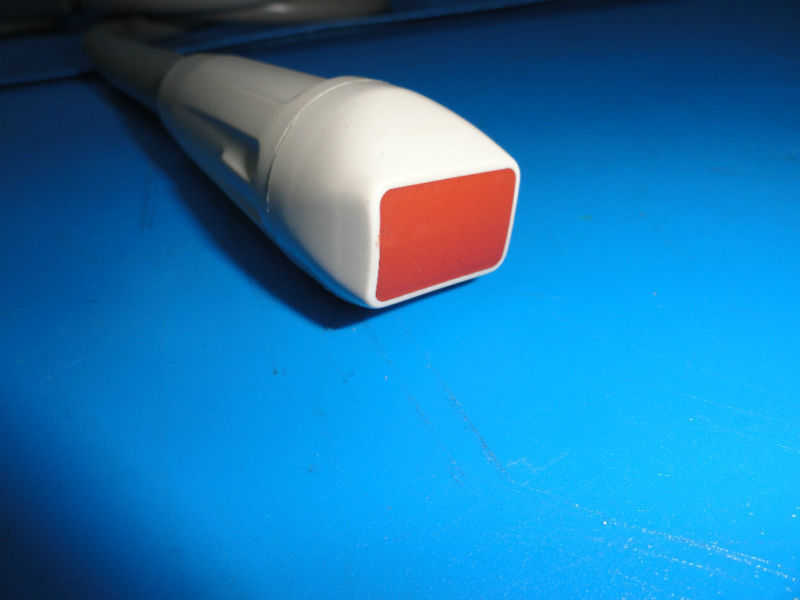 a close up of a white and red object on a blue surface