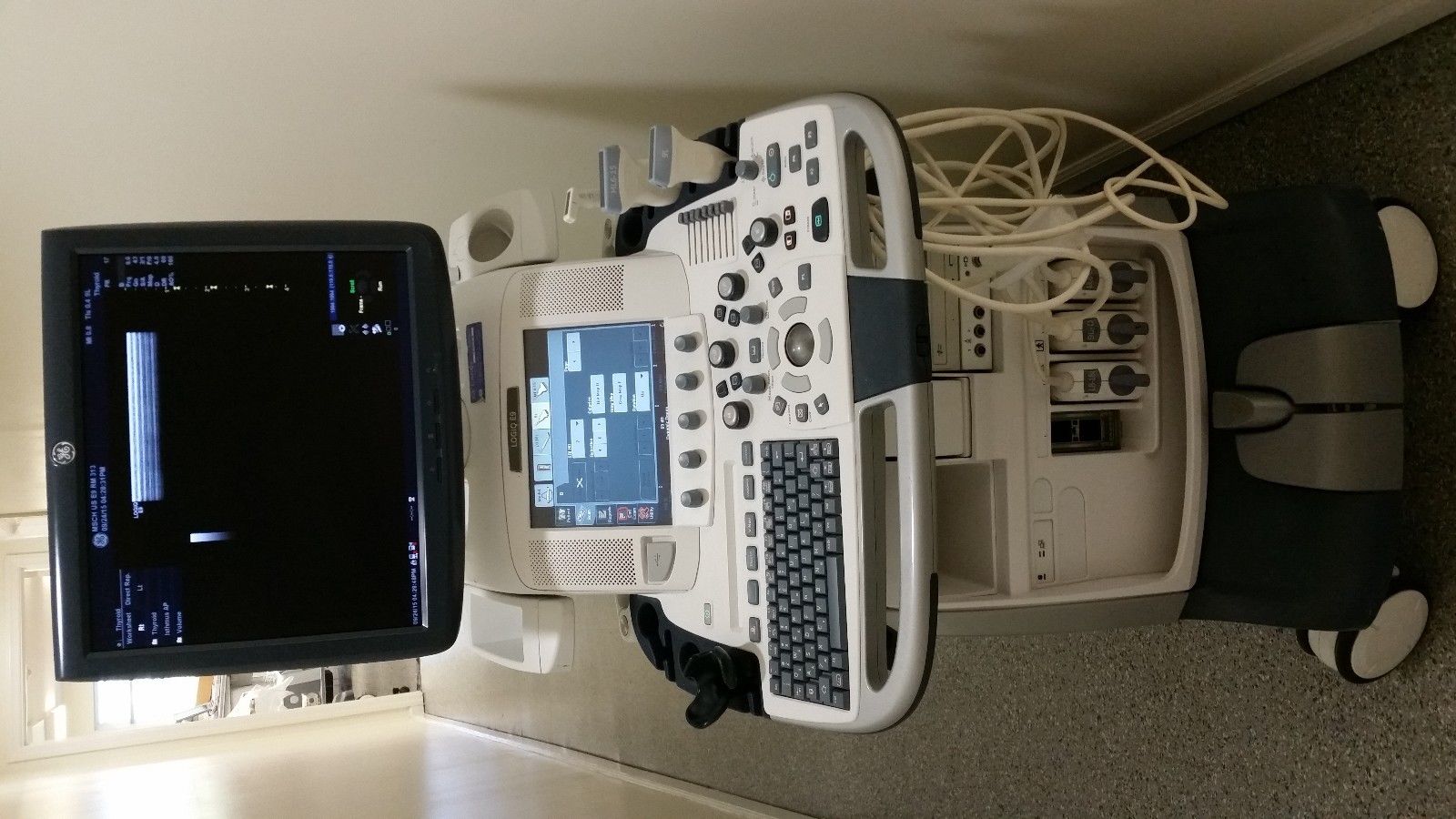a computer ultrasound monitor sitting on top of a counter