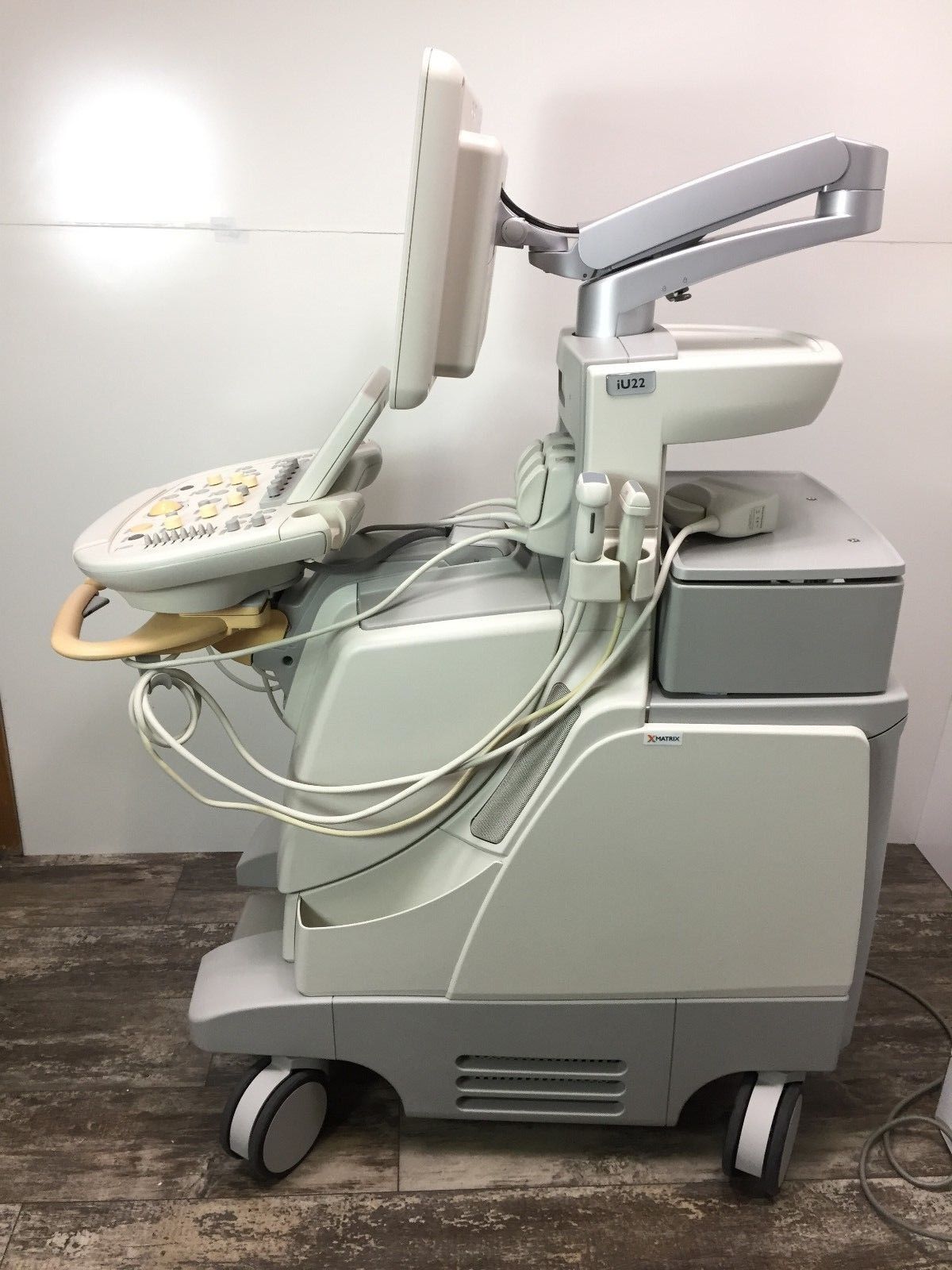 a medical device is sitting on a wooden floor