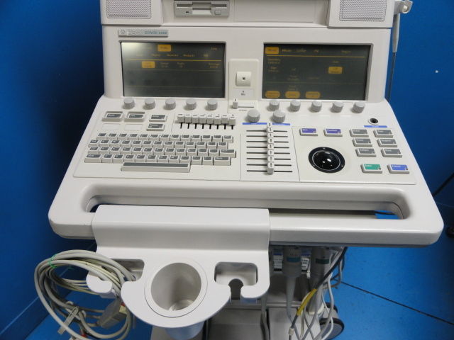a medical machine with two monitors on top of it