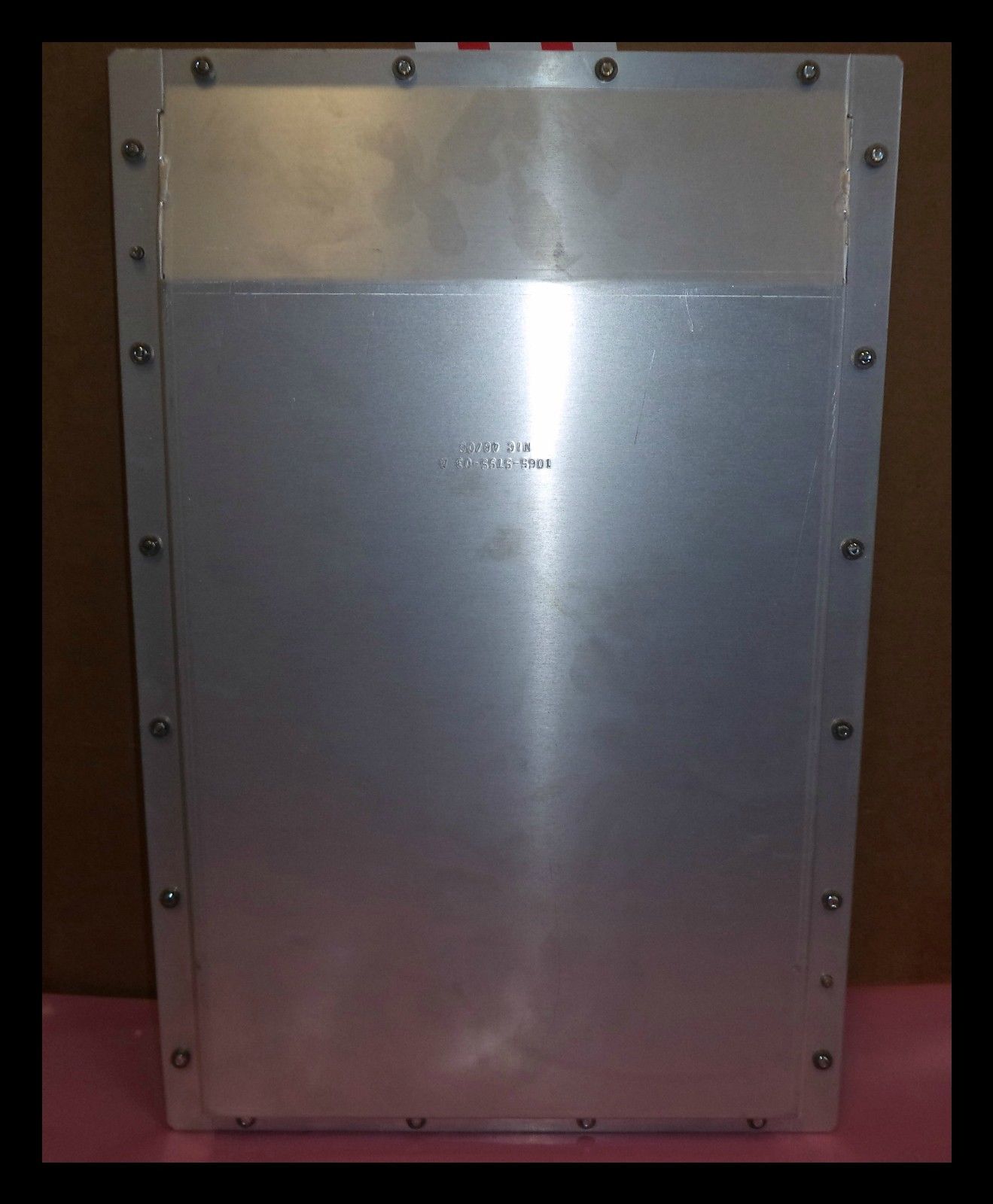 a metal box with rivets and rivet holes