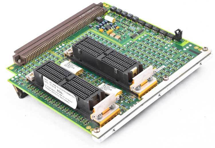 a close up of two electronic components on a white surface