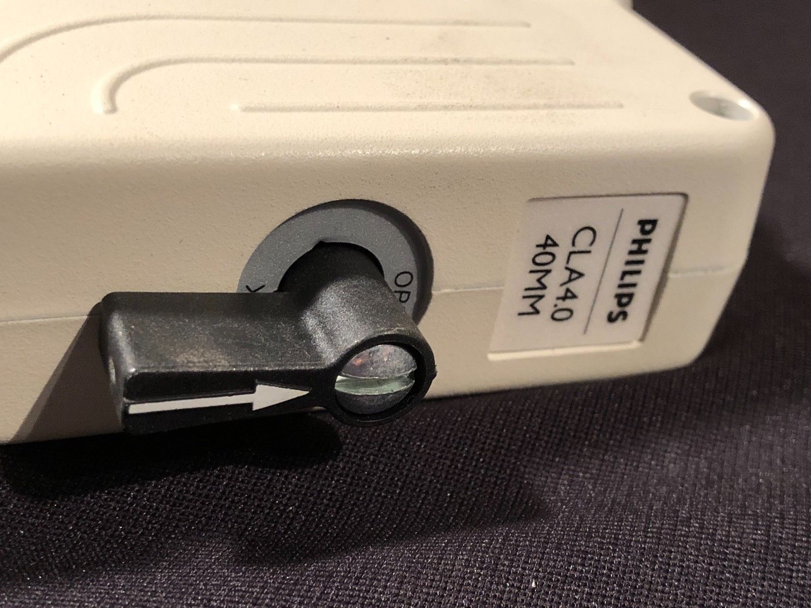 a close up of a white probe electronic device