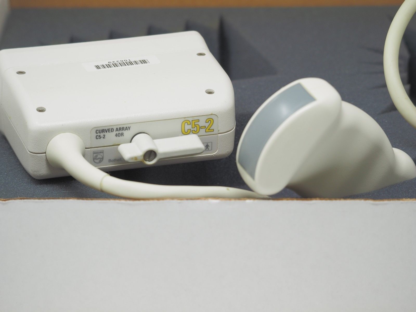 a white probe device sitting on top of a table
