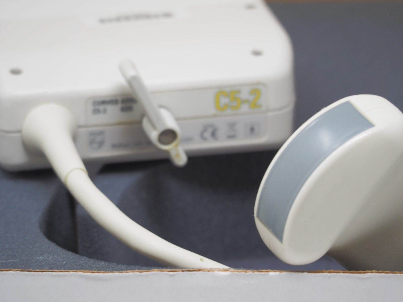 a close up of a white object probe on a table