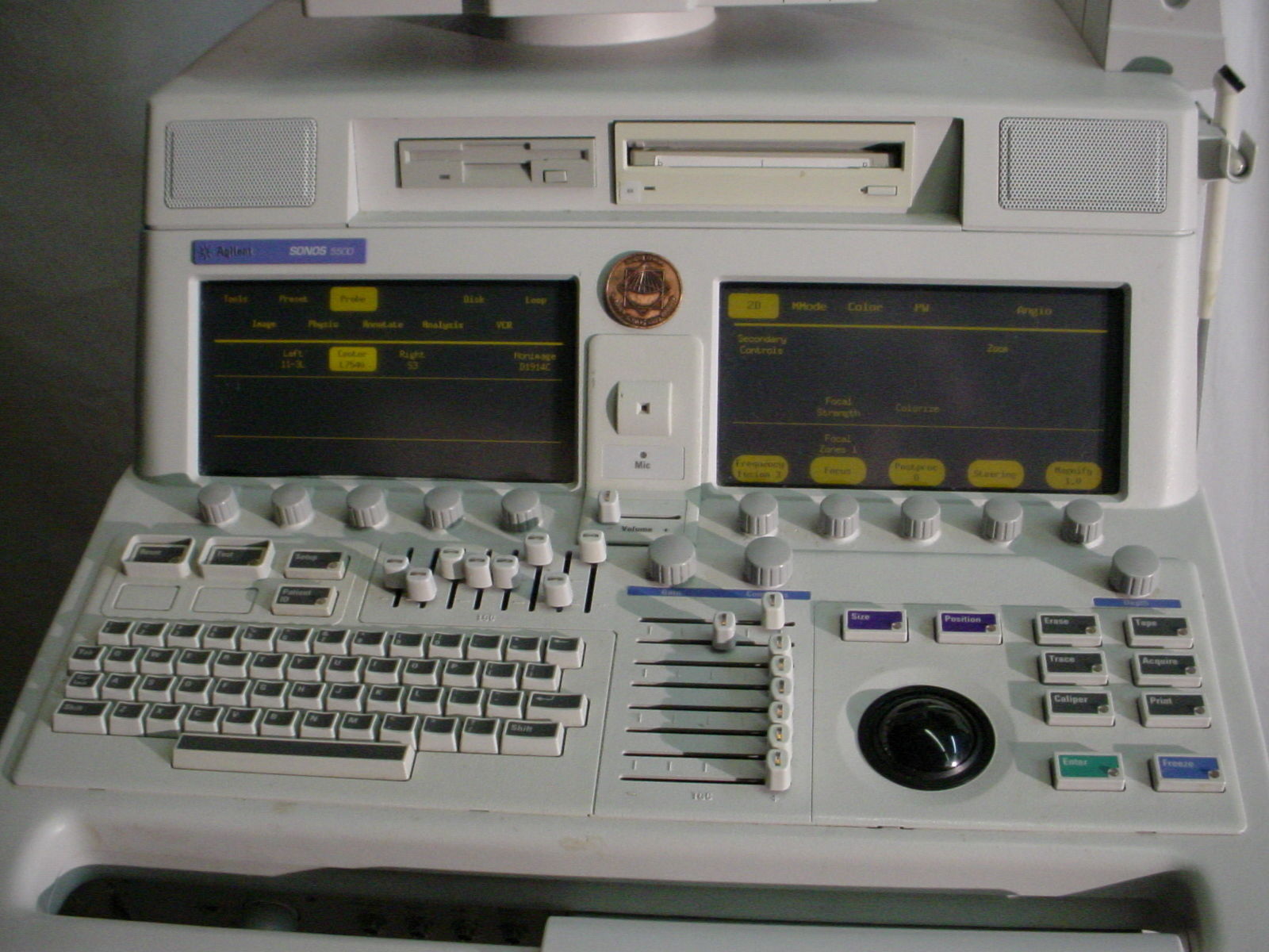 an old computer with two monitors and a keyboard
